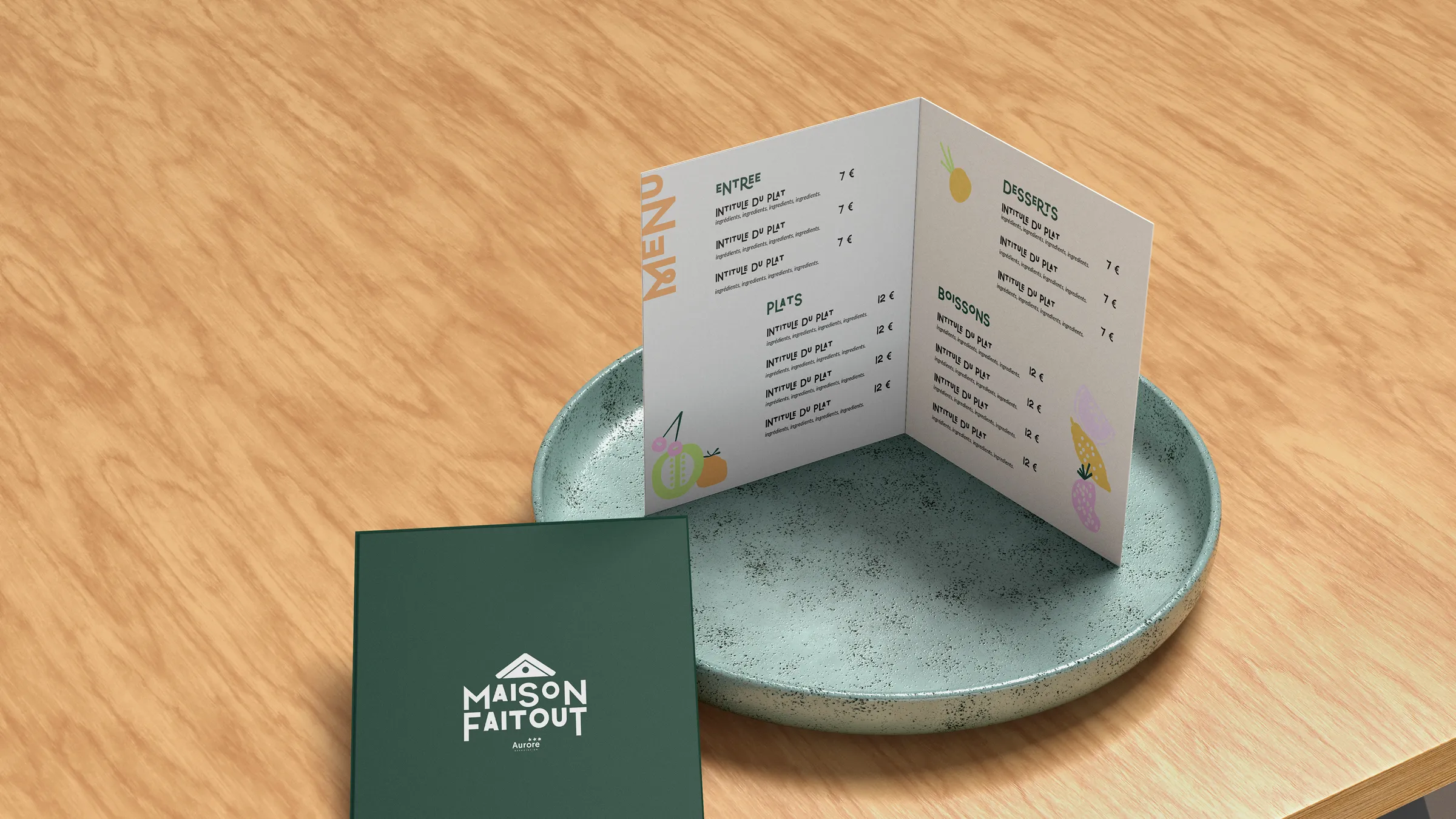 Menu Maison Faitout plié, posé sur un plateau à côté d'une carte au logo